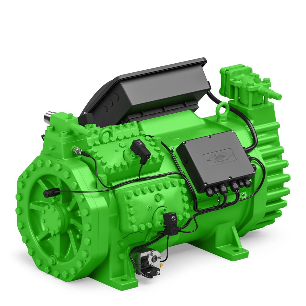 Groene industriële motor met kabels en modules.